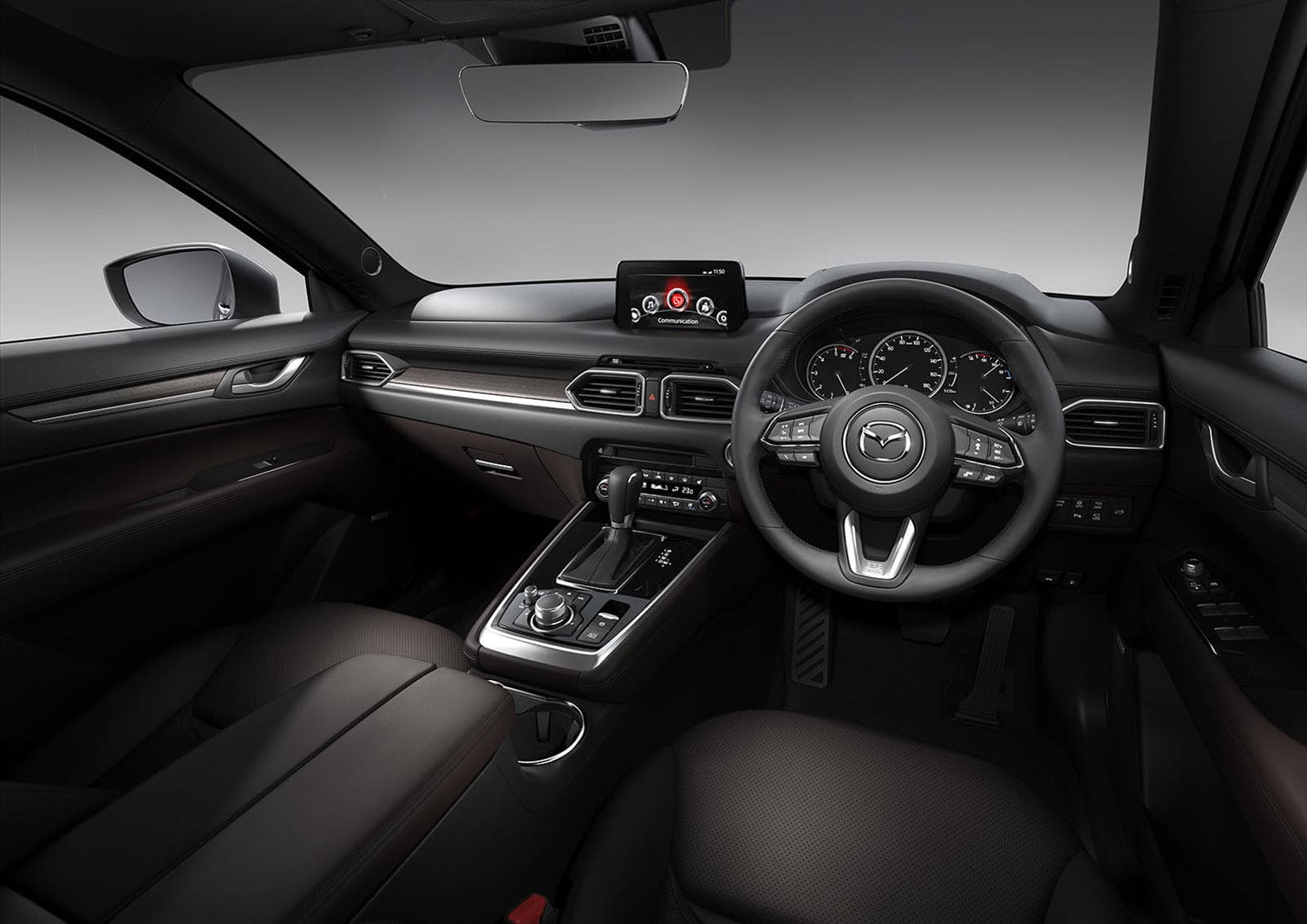 Interior dashboard and steering wheel of Mazda CX-8 with custom accessories.