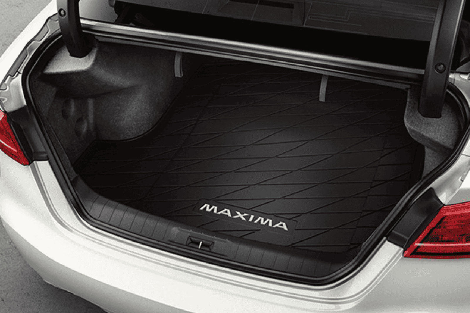 Luggage area mat for Nissan Maxima with custom fit and durable material. Protects trunk space and en.