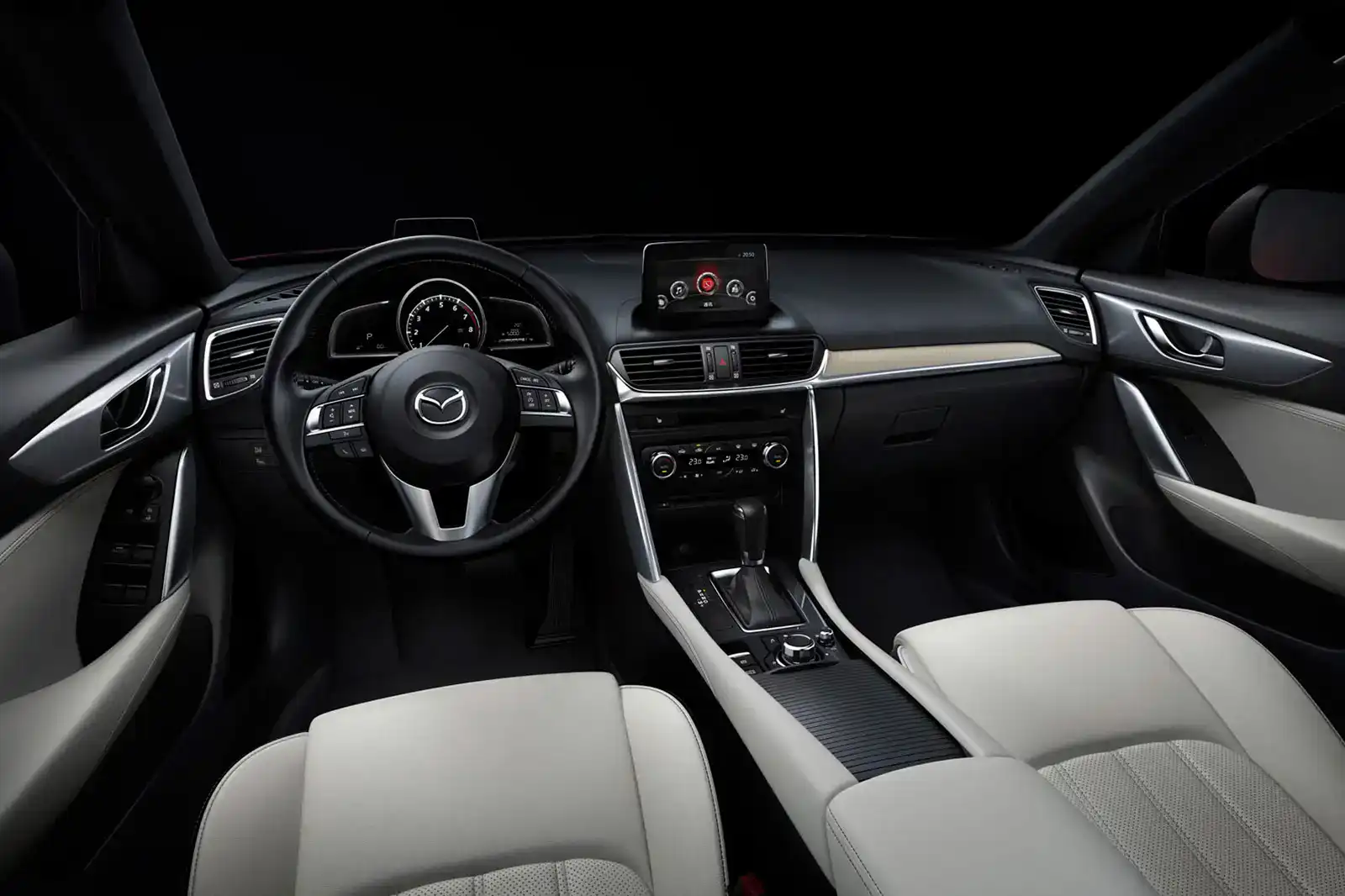 Interior dashboard and steering wheel of Mazda CX-4 with custom accessories.