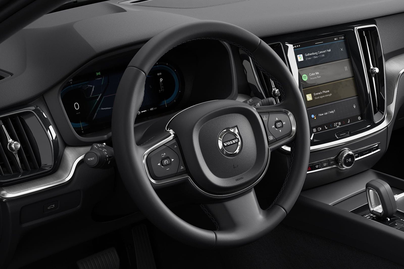 Interior dashboard with Volvo S60 touchscreen display and steering wheel.