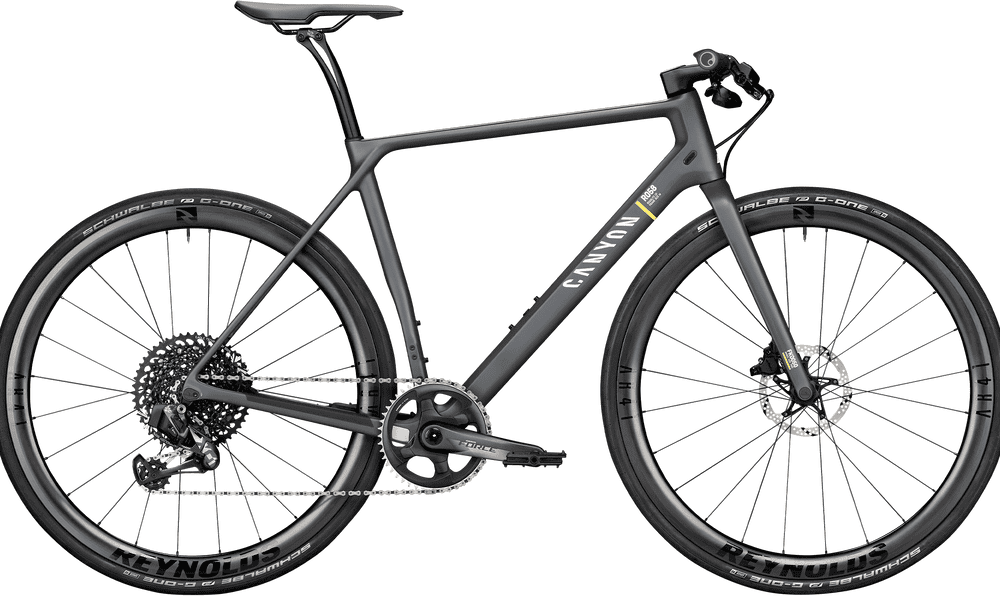 Lightweight carbon road bike with aerodynamic design and Shimano gears.