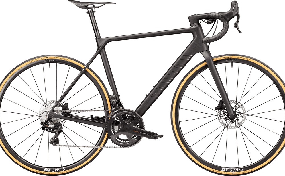 High-performance black carbon road bike with lightweight frame and aerodynamic design.