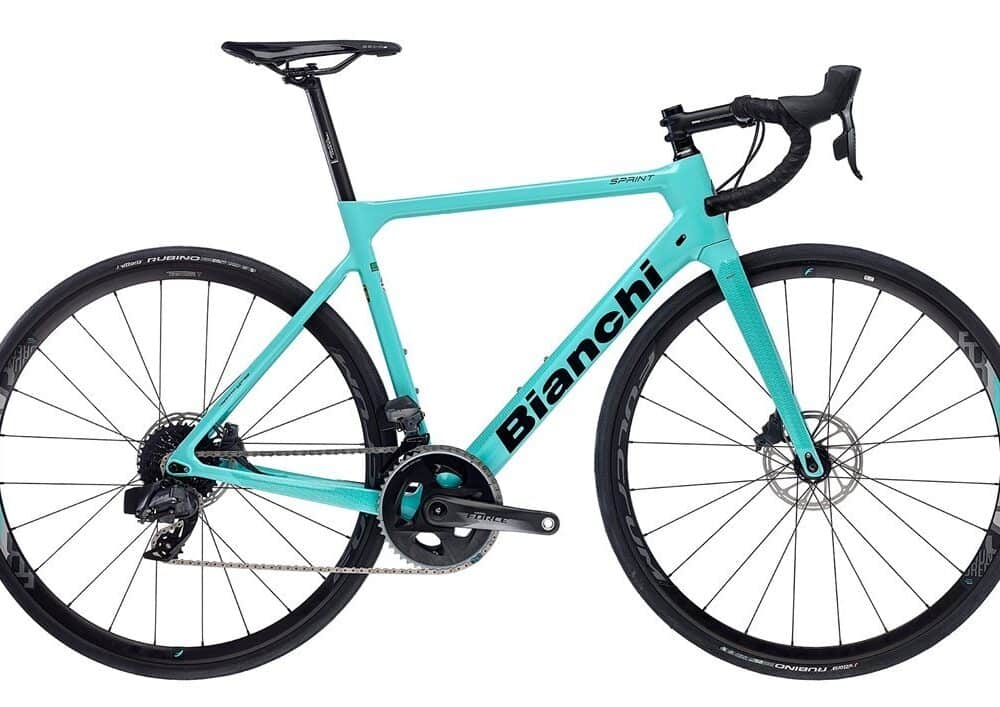 Bianchi road bike with lightweight frame and drop handlebars for cycling enthusiasts.