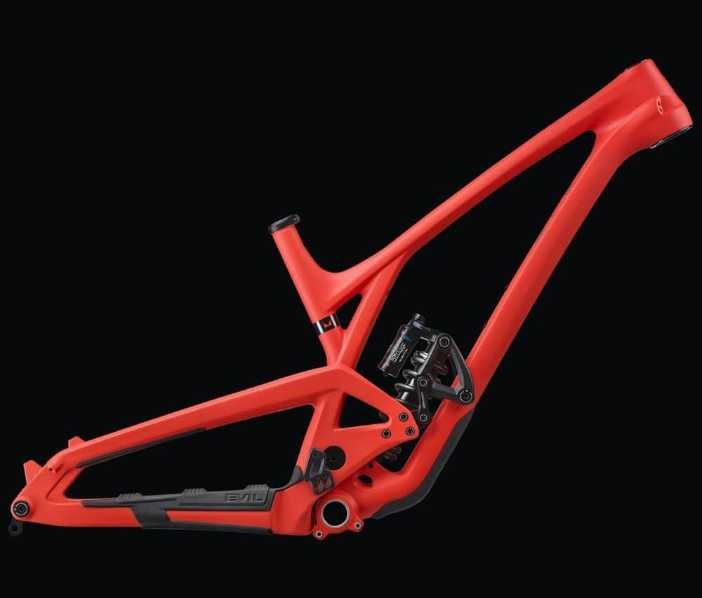 Red mountain bike frame with protective film for frame protection.