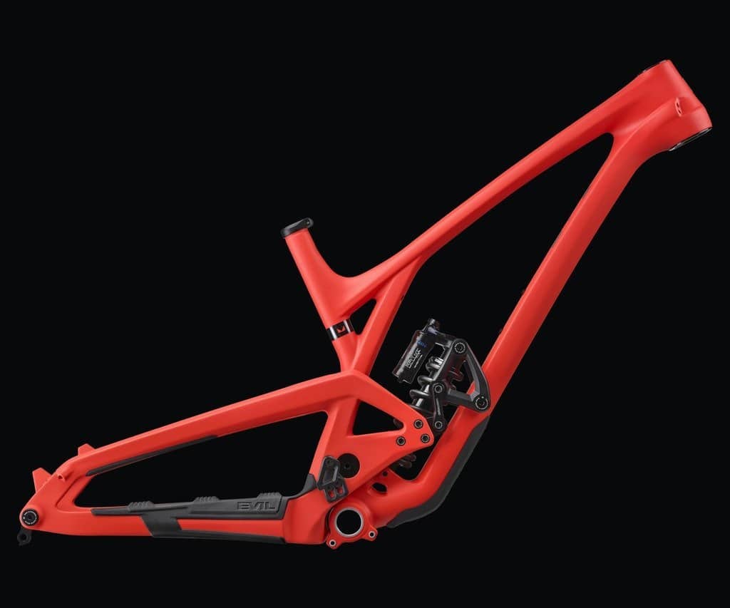 Red mountain bike frame with protective film for frame protection.