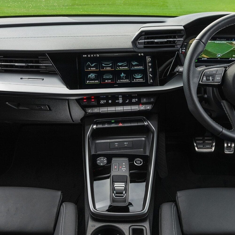 Modern car interior dashboard with touchscreen and gear shift for comfortable driving.