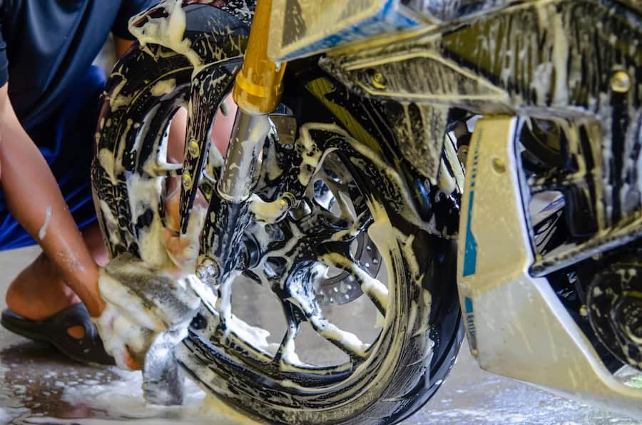 Bike being detailed with PPF protective film application during professional motorcycle detailing.