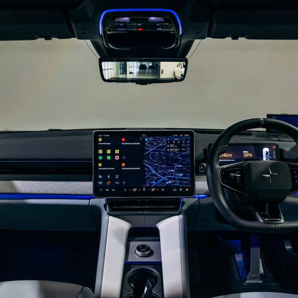 Interior dashboard of Polestar 4 with advanced digital displays and steering wheel.