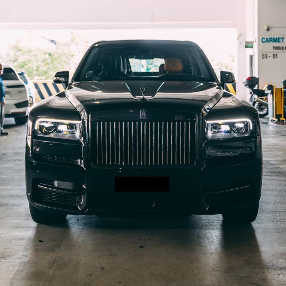 Black Rolls Royce with PPF protection in garage.