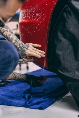 High-quality PPF film applied to car side fender and bumper for protection.