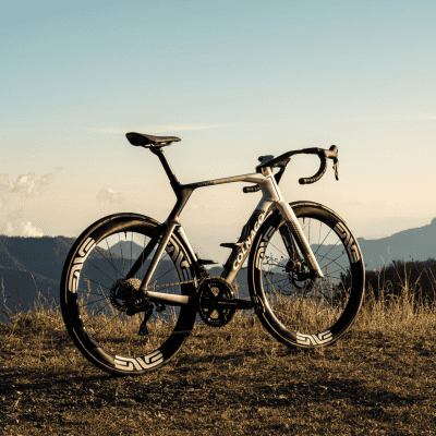 High-performance Colnago Y1RS road bike on scenic mountain background.