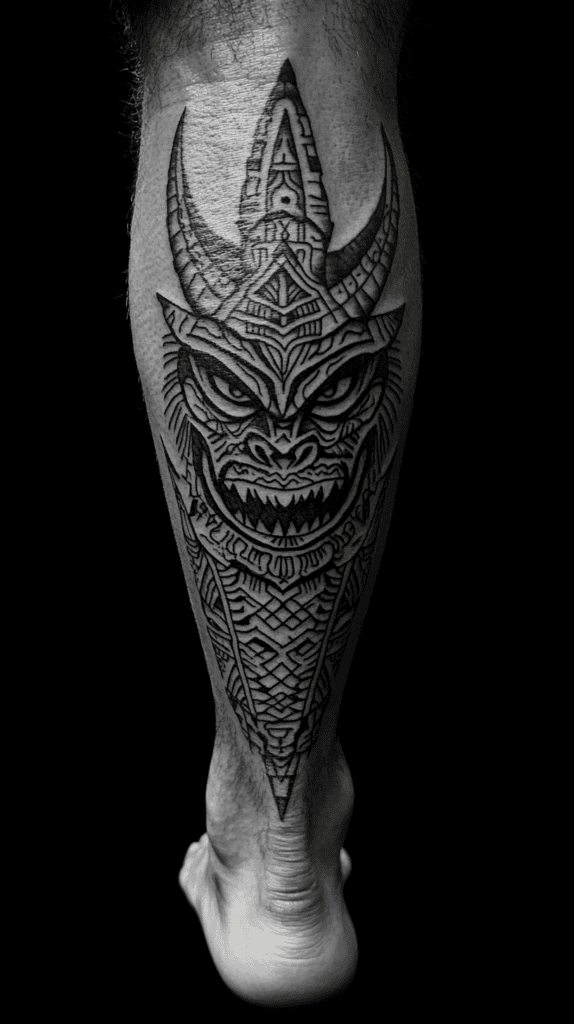 Unleash Your Dark Side: 23 Devilishly Unique Tattoo Ideas for Men 16 Tribal Devil Design