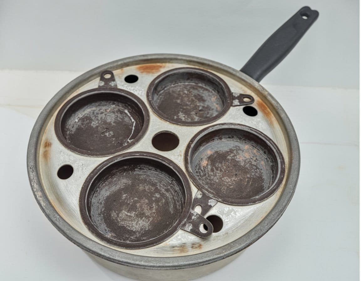 Kitchen Gadgets That Were Staples in Every '60s Home 15 a round cooking pan with a handle inside b1T5gjzqS6ejZK F06g83A Ukh7blj4SrmMF138Y2nV1Q