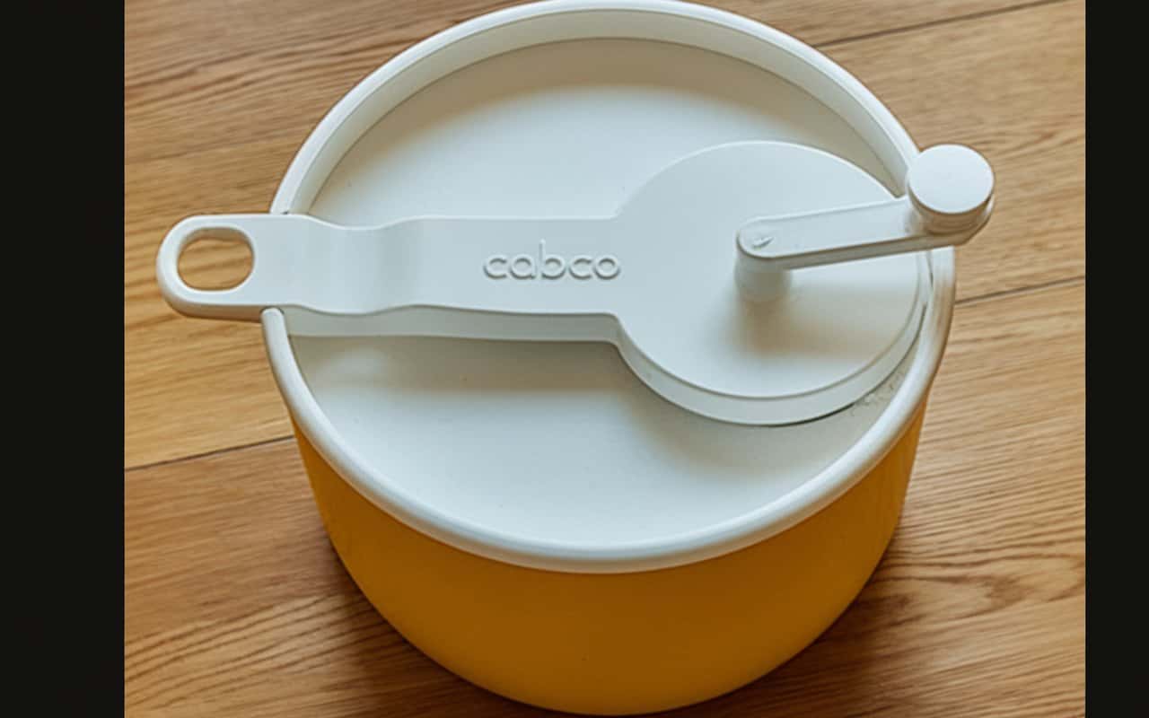 Kitchen Gadgets That Were Staples in Every '60s Home 16 a yellow container with a white lid the pPr3xKsaQiyC b Rdm3ZYQ BvW1duKYTDajbWuqbsBU3Q