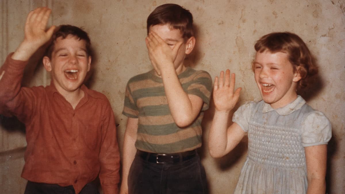 Children playing Simon Says in a lively 1950s backyard setting.