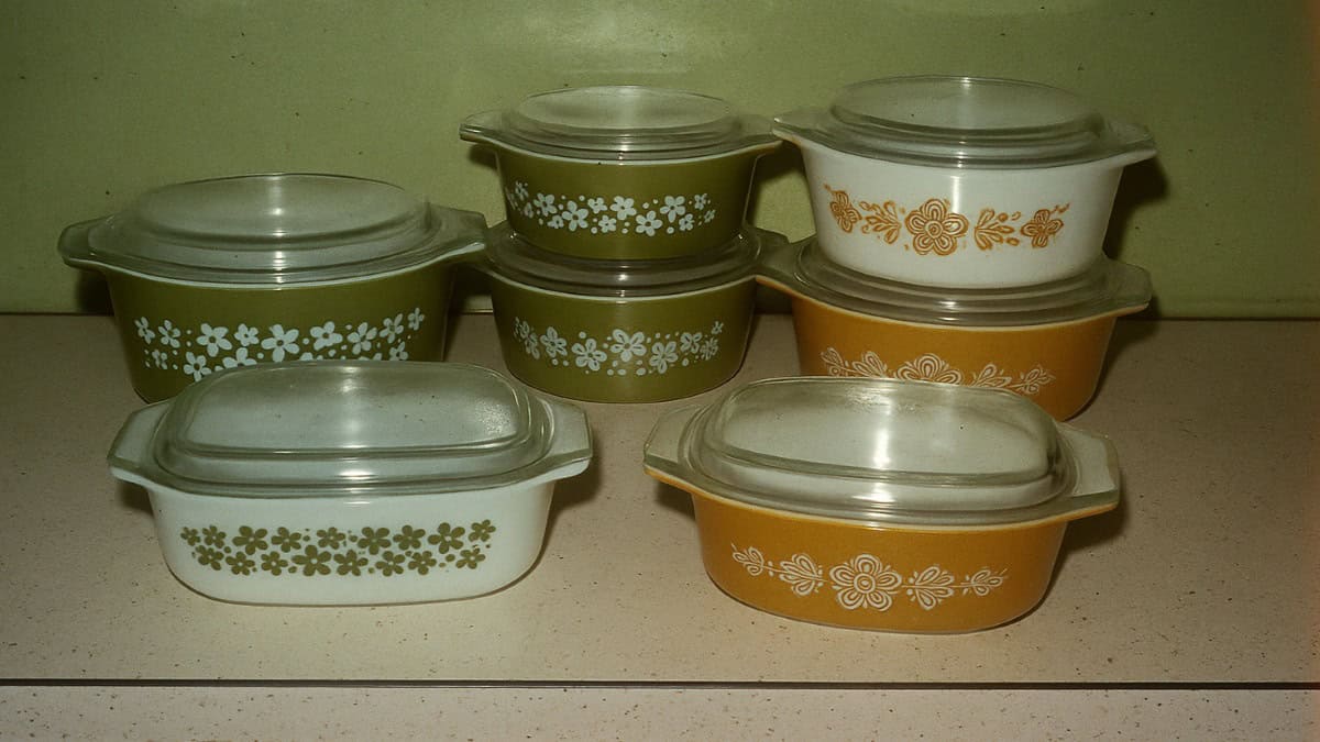 Close-up of a vintage Pyrex casserole dish, a valuable 70s grocery item.