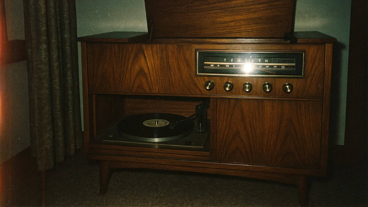 Vintage console radio/record player, a cherished item from grandma's era, now fading.