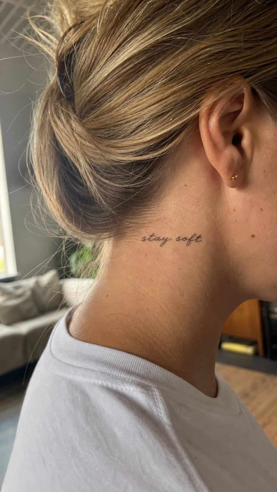 From Delicate to Daring: 28 Neck Tattoo Ideas for Every Woman 7 Elegant Script Quote neck tattoo idea