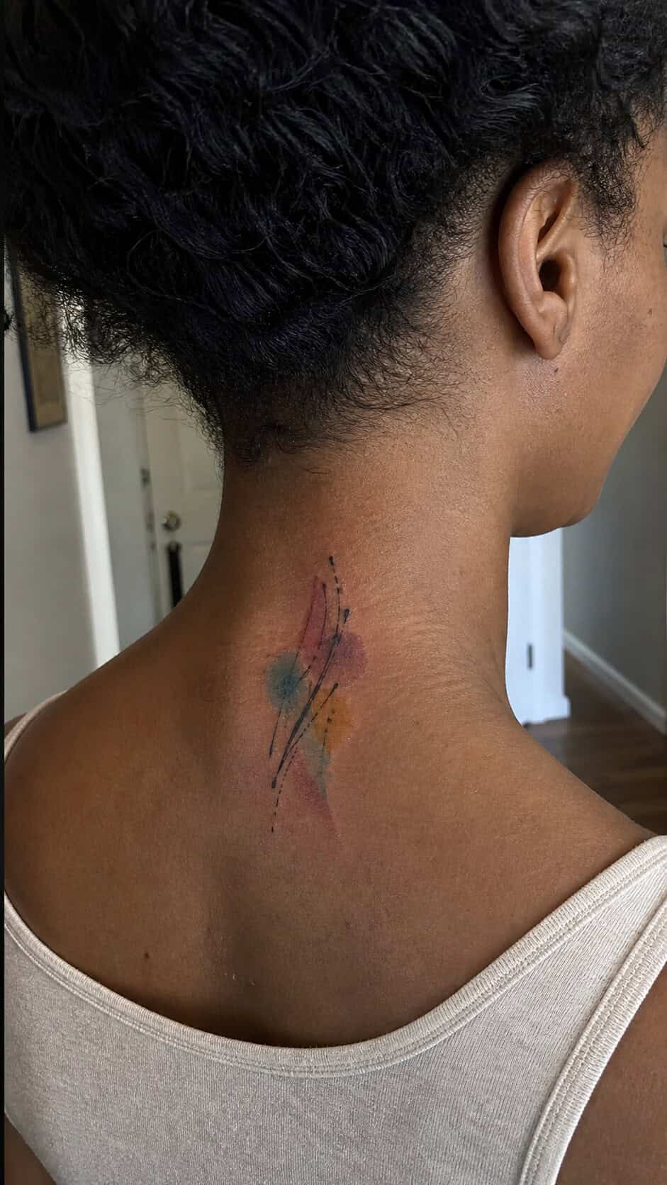 From Delicate to Daring: 28 Neck Tattoo Ideas for Every Woman 9 Abstract Watercolor Splash neck tattoo idea