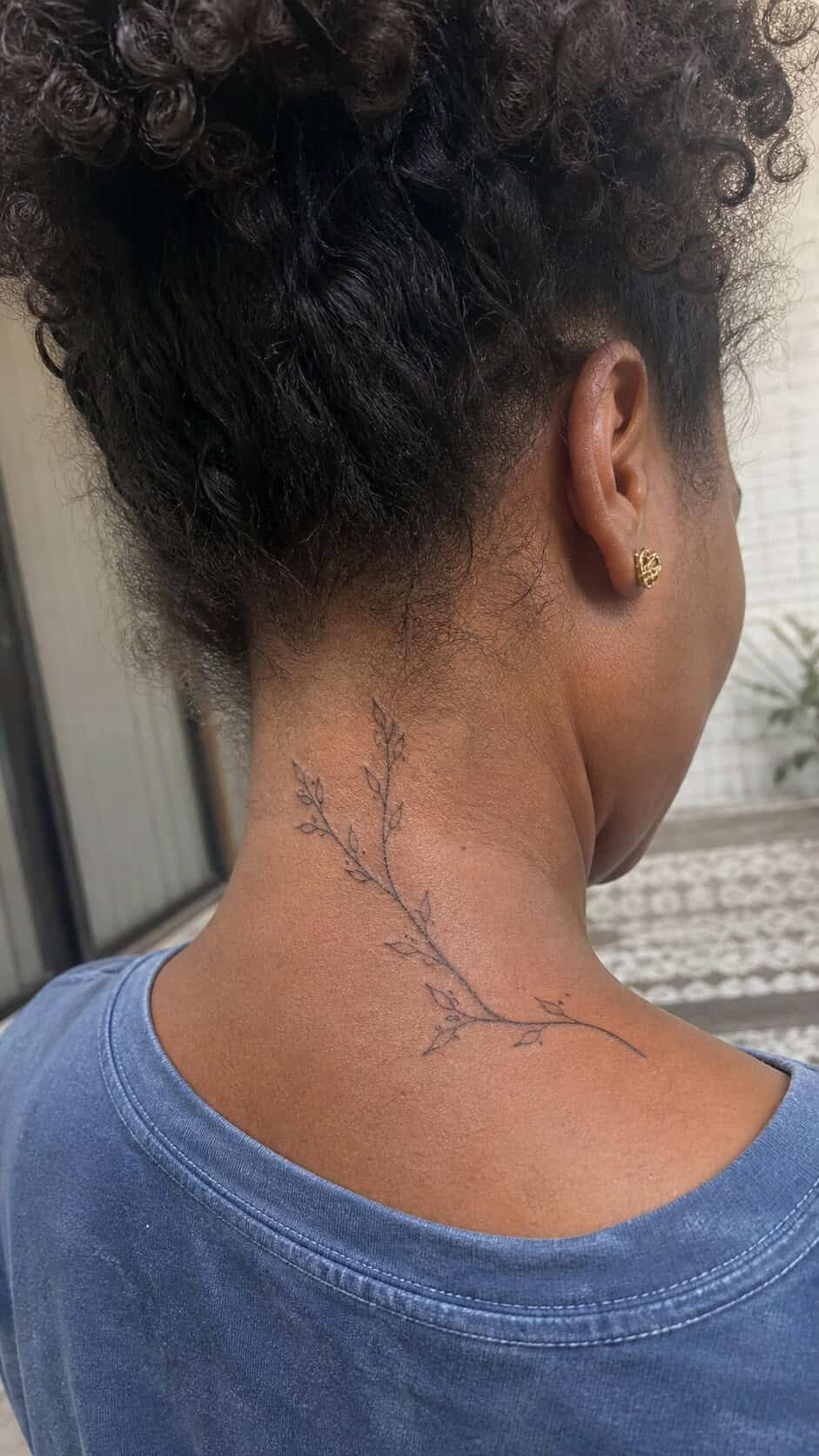 From Delicate to Daring: 28 Neck Tattoo Ideas for Every Woman 30 Nature's Branches neck tattoo idea, example 2