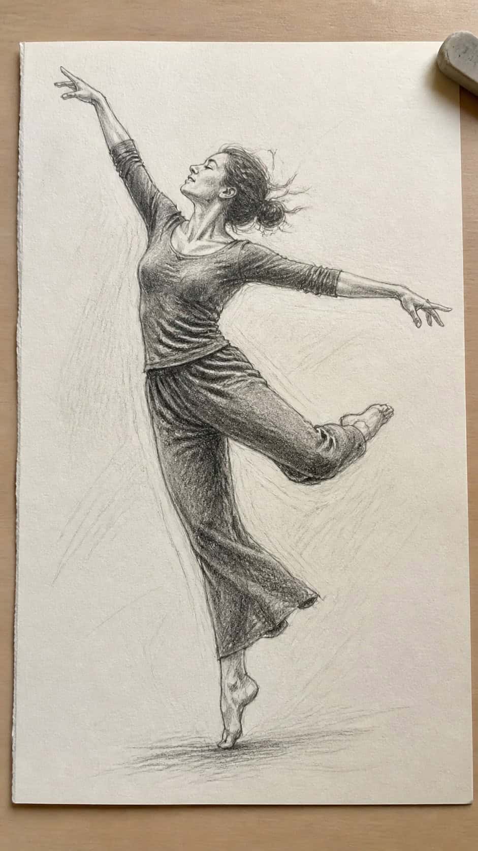 Hand-drawn joyful dance movement in graphite drawing on textured paper, shown in a close overhead crop — study 2