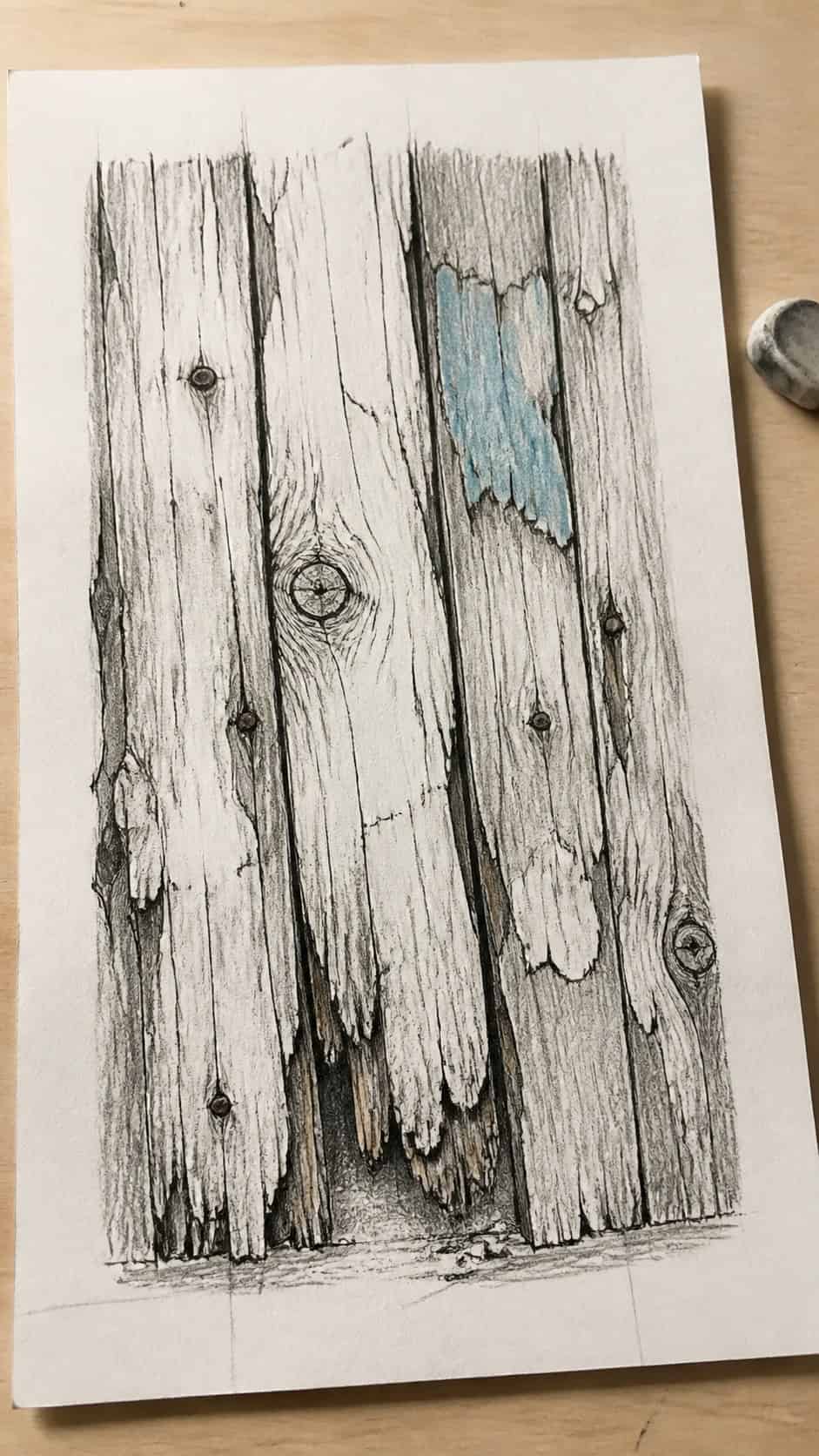 30 Grunge Drawing Ideas for Real Depth and Texture 38 Hand-drawn distressed wood in mixed-media hand drawing on textured paper, shown in a gentle oblique desk view that shows paper tooth — study 1