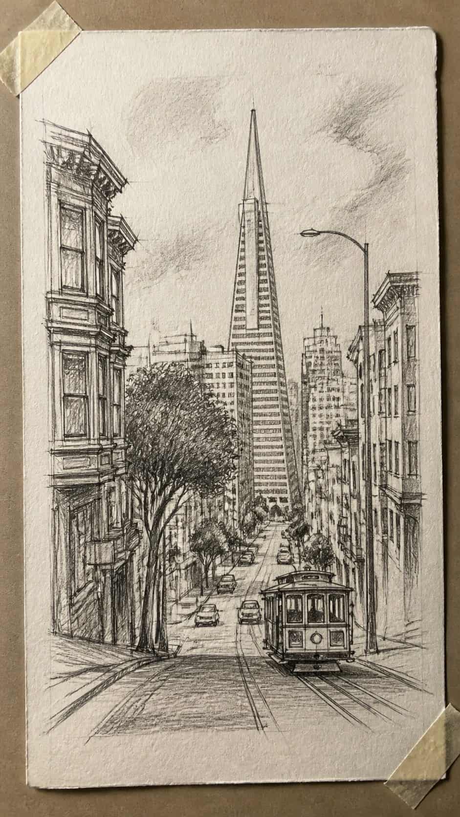 Hand-drawn urban sketches in graphite drawing on textured paper, shown in a close overhead crop — study 1