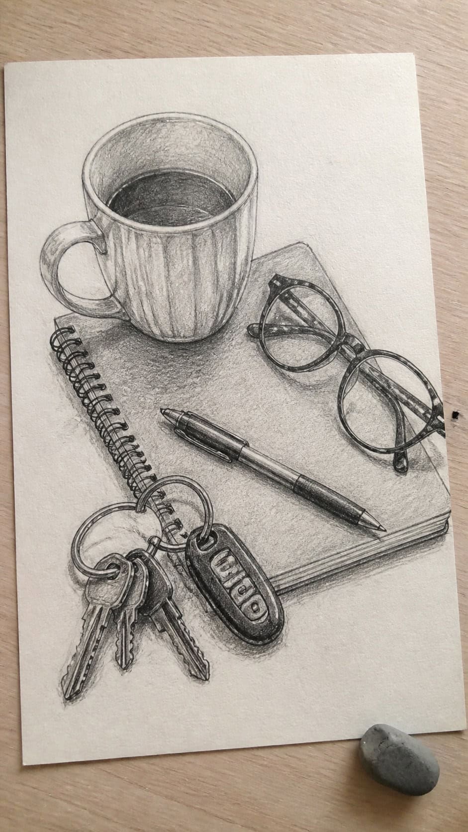 Hand-drawn everyday objects in graphite drawing on textured paper, shown in a slightly off-center overhead composition, like an artist — study 1
