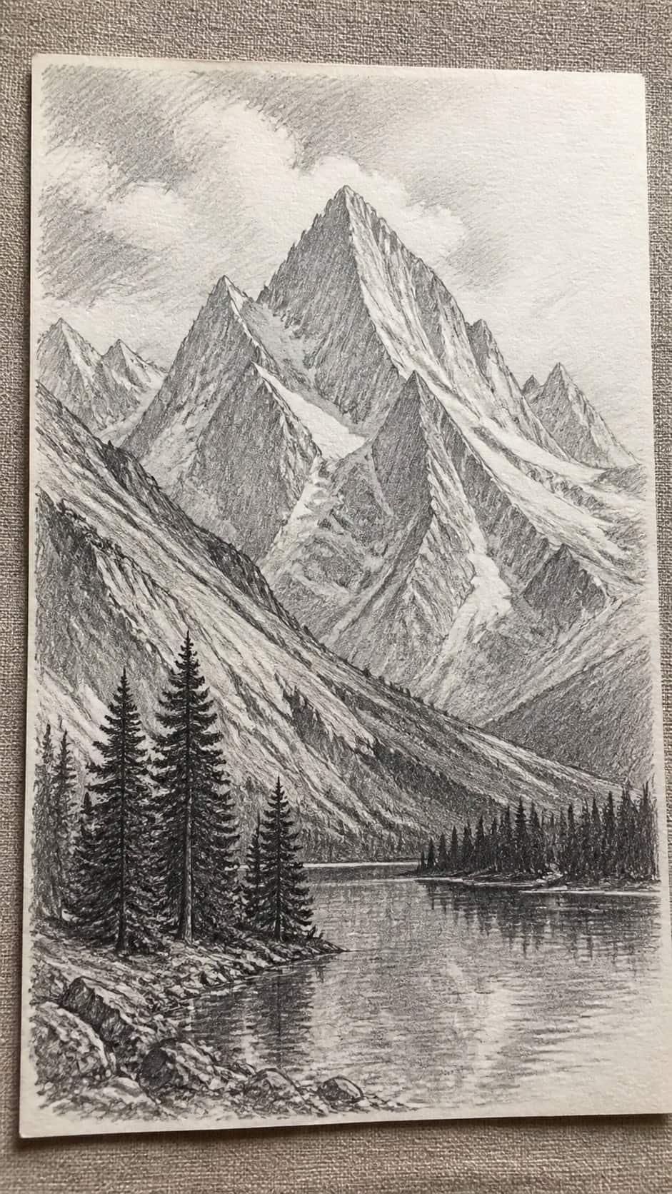 Hand-drawn majestic mountain range in graphite drawing on textured paper, shown in a slightly off-center overhead composition, like an — study 2