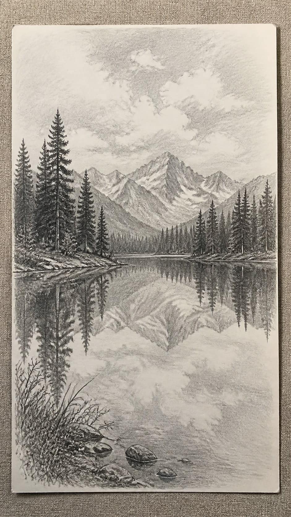 Hand-drawn serene lake reflection in graphite drawing on textured paper, shown in a straight overhead view — study 3