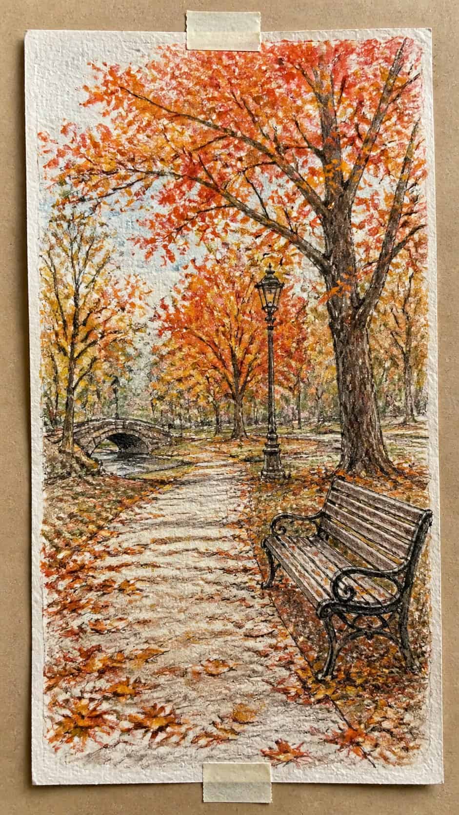 Hand-drawn autumn park scene in colored-pencil and gouache drawing on textured paper, shown in a straight overhead view — study 2