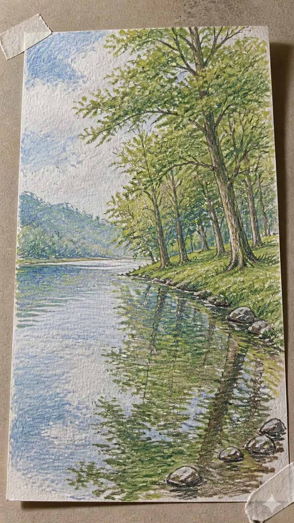 Hand-drawn peaceful riverbank in colored-pencil and gouache drawing on textured paper, shown in a gentle oblique desk view that shows — study 1