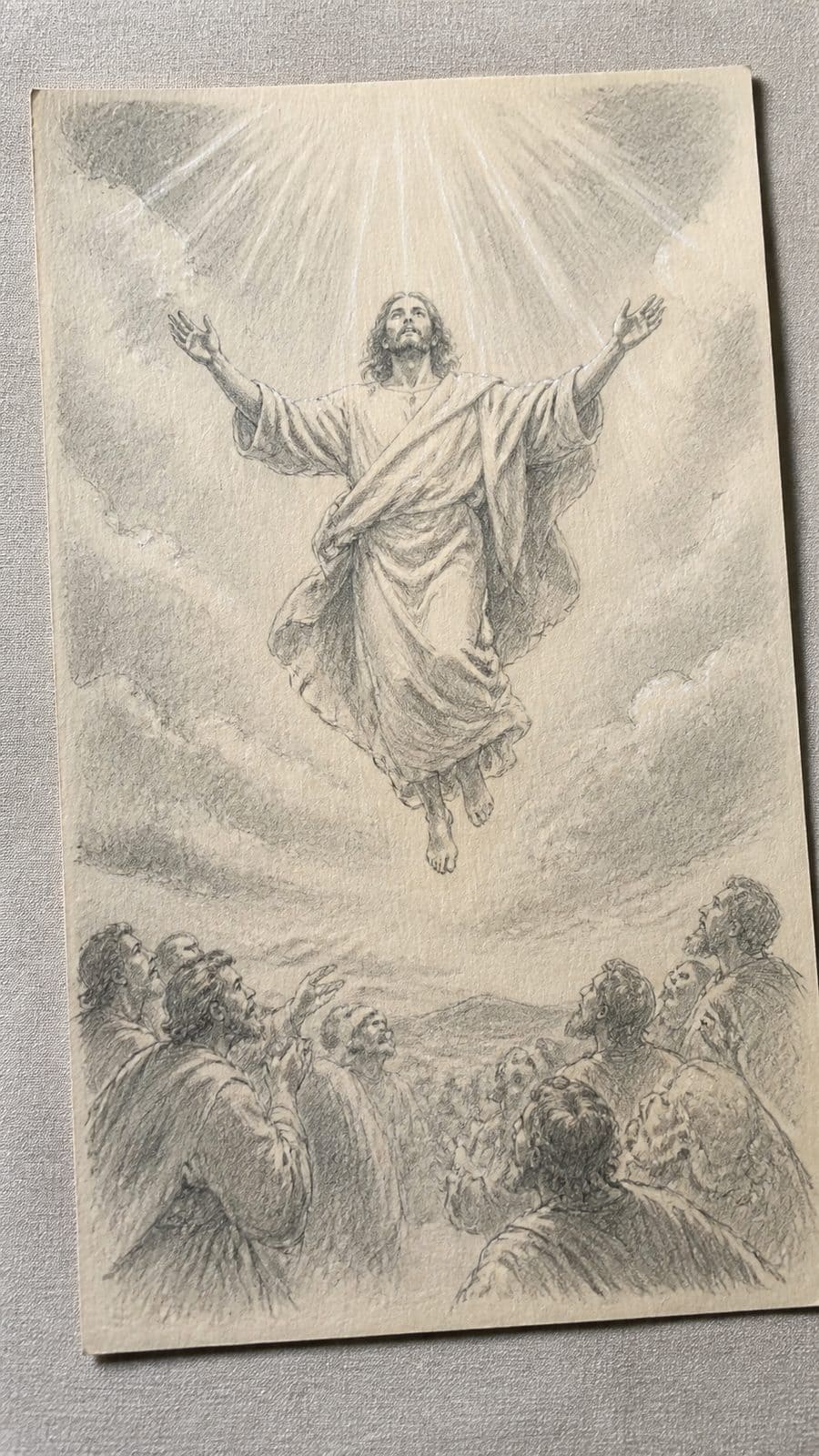 Hand-drawn the ascension in graphite drawing on textured paper, shown in a gentle oblique desk view that shows paper tooth and shallow — study 2