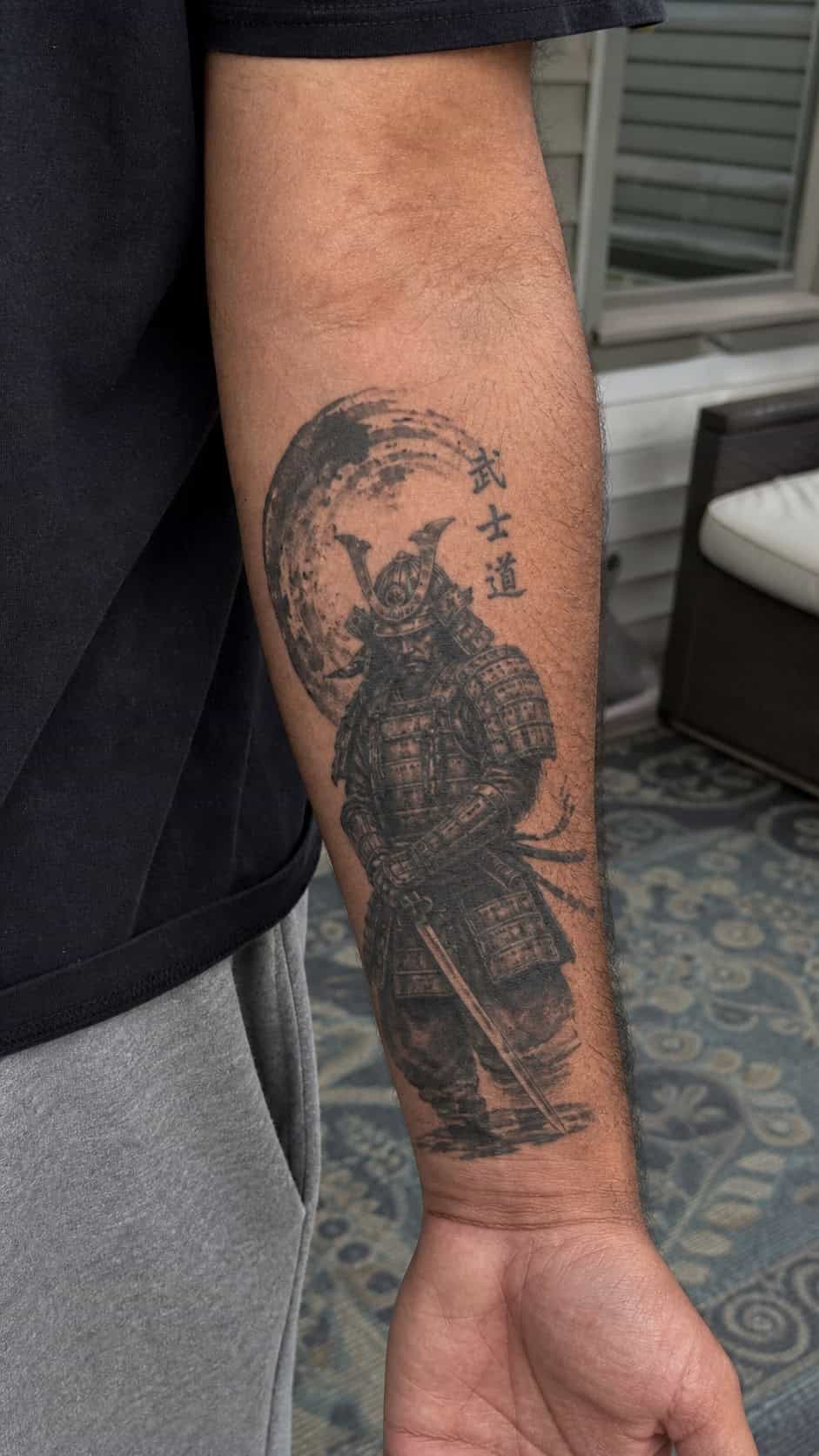 From Samurai to Dragons: 19 Stunning Japanese Tattoo Ideas for Men 2 Healed samurai warrior tattoo on a adult man's inner forearm, photographed in a natural straight-on close view, a touch off-center — study 1