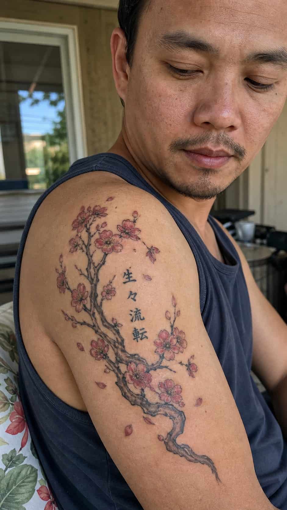 From Samurai to Dragons: 19 Stunning Japanese Tattoo Ideas for Men 10 Healed cherry blossoms tattoo on a adult man's shoulder, photographed in a natural slightly elevated close view — study 1
