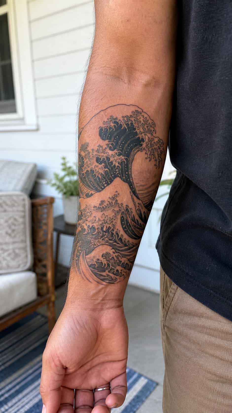 From Samurai to Dragons: 19 Stunning Japanese Tattoo Ideas for Men 21 Healed wave patterns tattoo on a adult man's inner forearm, photographed in a natural gentle side angle that clearly shows how the ink — study 1