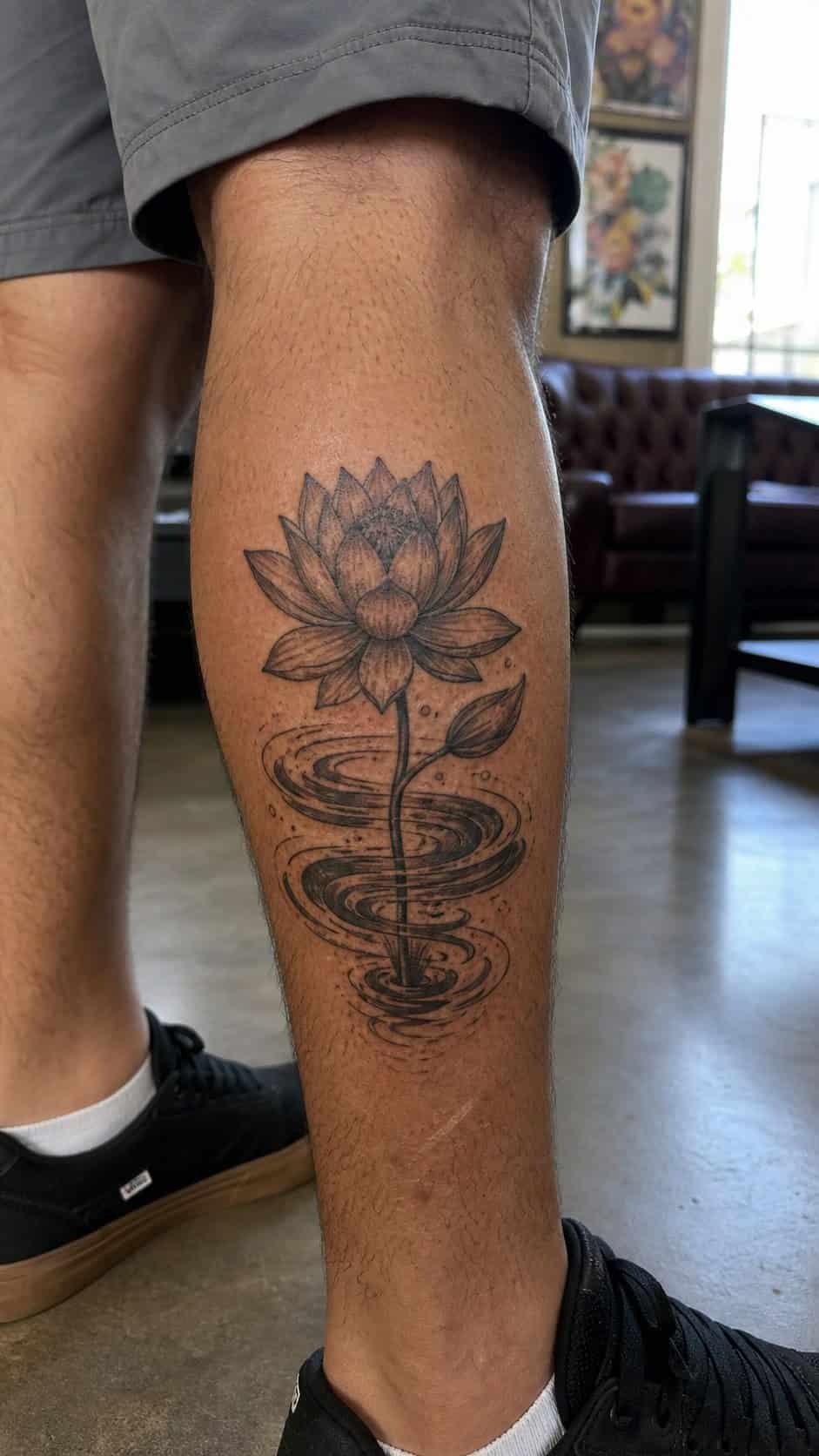 From Samurai to Dragons: 19 Stunning Japanese Tattoo Ideas for Men 26 Healed lotus flower tattoo on a adult man's outer calf, photographed in a natural waist-height candid close-up — study 2