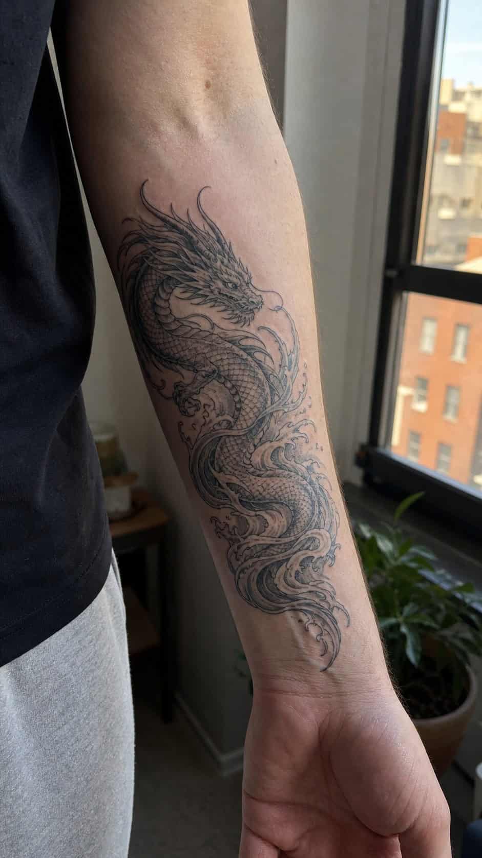 From Samurai to Dragons: 19 Stunning Japanese Tattoo Ideas for Men 41 Healed water dragon (mizuryu) tattoo on a adult man's inner forearm, photographed in a natural relaxed documentary crop — study 1
