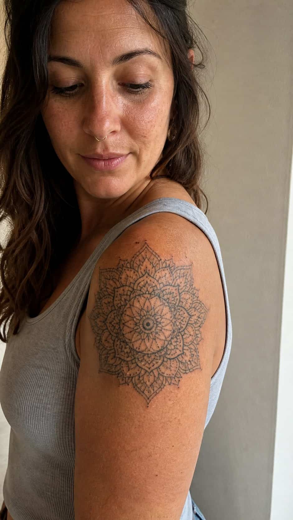 Healed delicate mandala pattern tattoo on a adult woman's shoulder, photographed in a natural gentle side angle that clearly shows how — study 1