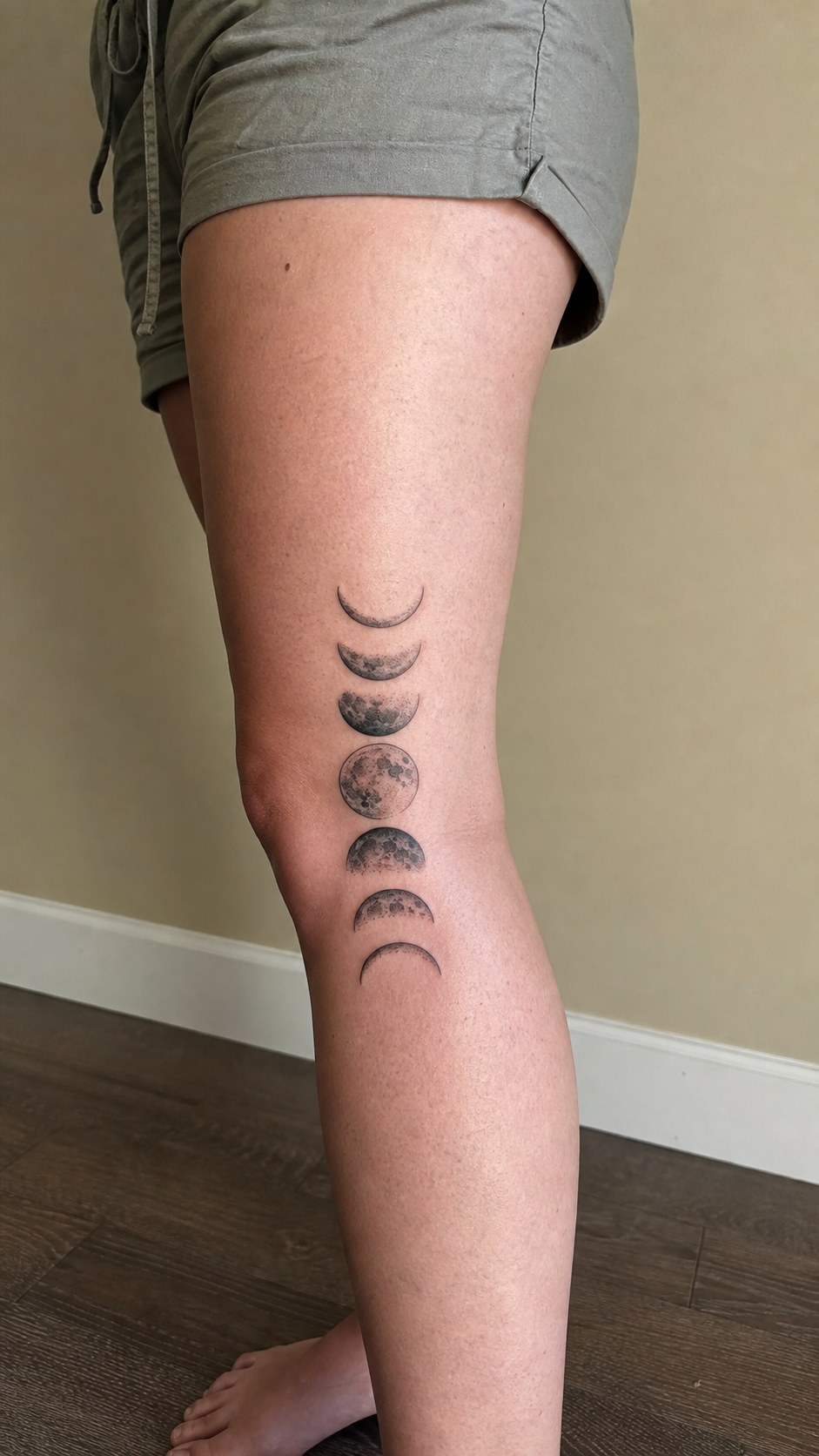 Healed mystical moon phases tattoo on a adult woman's outer calf, photographed in a natural gentle side angle that clearly shows how — study 2