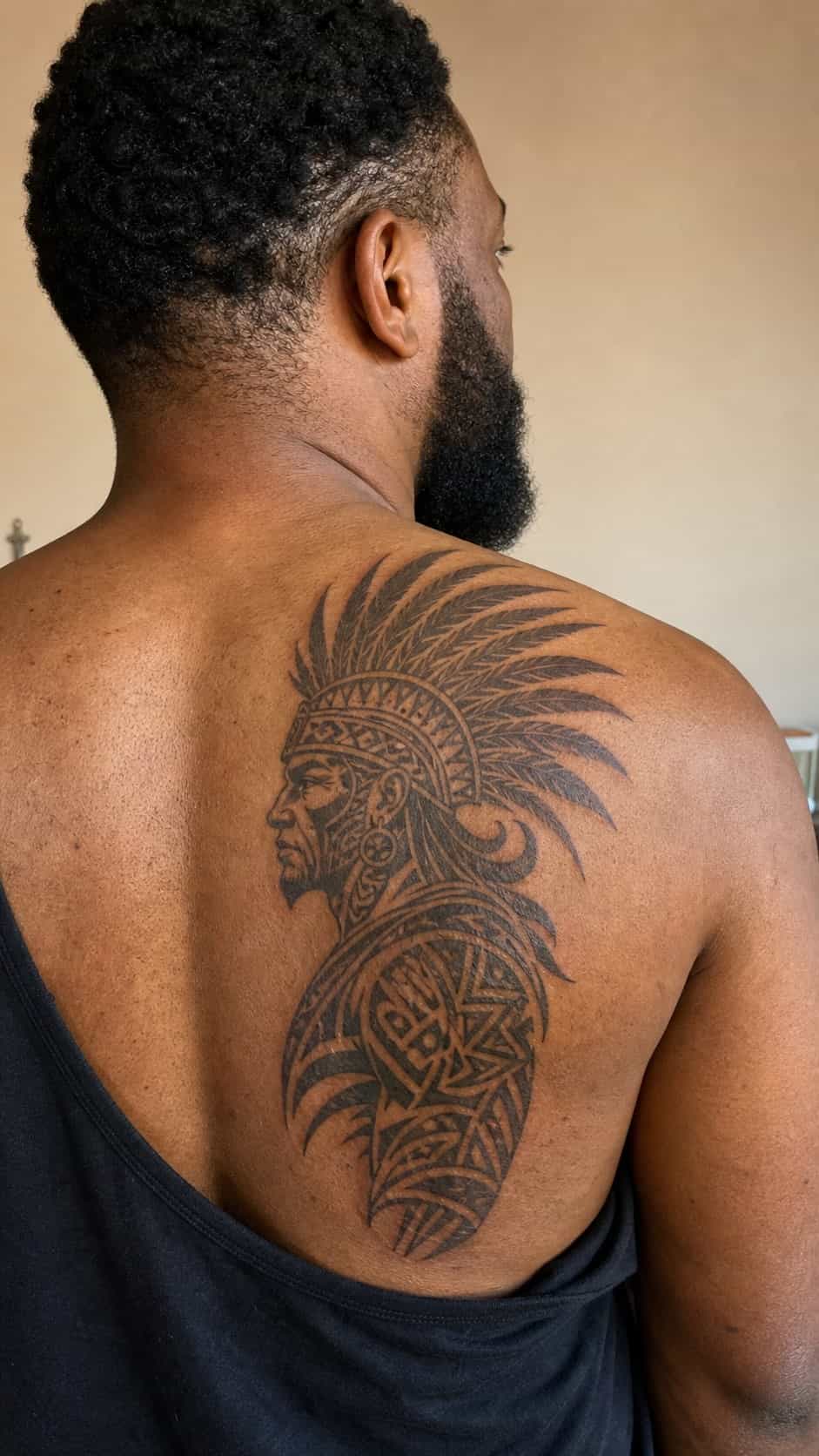 The Art of Ink: 23 Inspirational Back Tattoos for Men 8 Healed tribal warrior tattoo on a adult man's side ribs, photographed in a natural gentle side angle that clearly shows how the ink — study 2