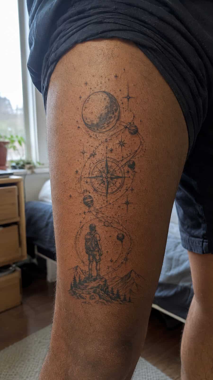 48 Tattoo Ideas for Men Worth Considering for Your Next Ink 7 Healed celestial wanderlust tattoo on a adult man's outer thigh, photographed in a natural straight-on close view, a touch off-center — study 2