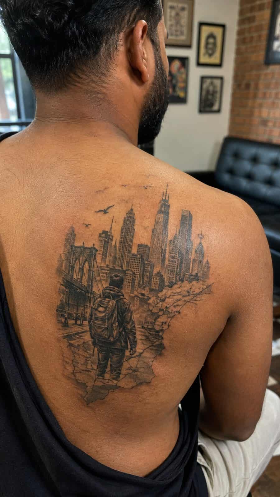 48 Tattoo Ideas for Men Worth Considering for Your Next Ink 9 Healed urban expedition tattoo on a adult man's upper back, photographed in a natural slightly elevated close view — study 1