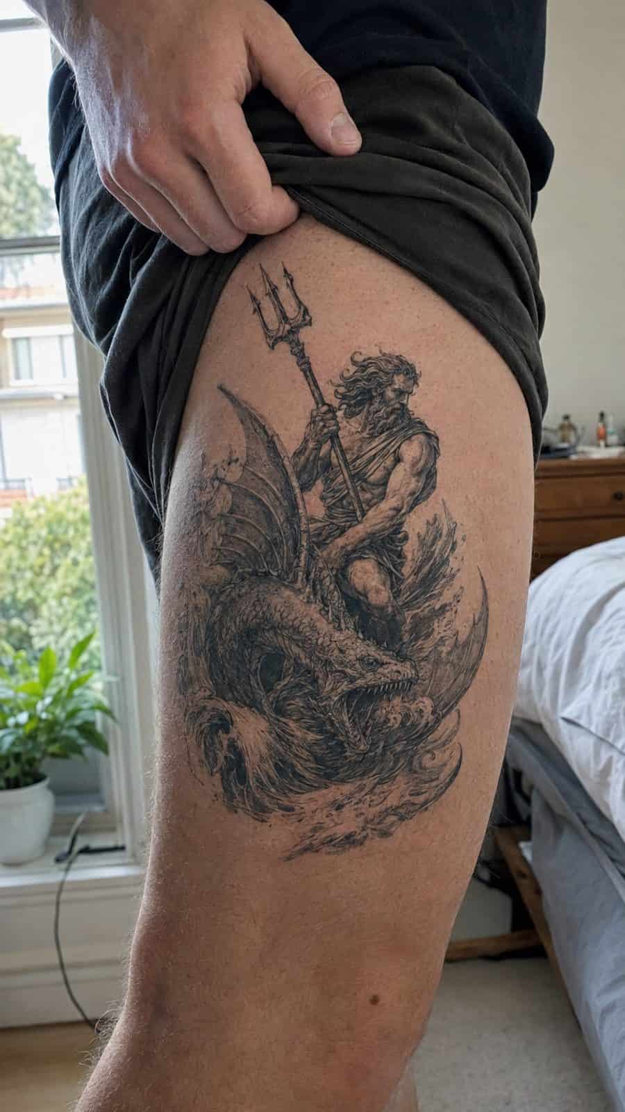 48 Tattoo Ideas for Men Worth Considering for Your Next Ink 12 Healed mythical echoes tattoo on a adult man's outer thigh, photographed in a natural waist-height candid close-up — study 2