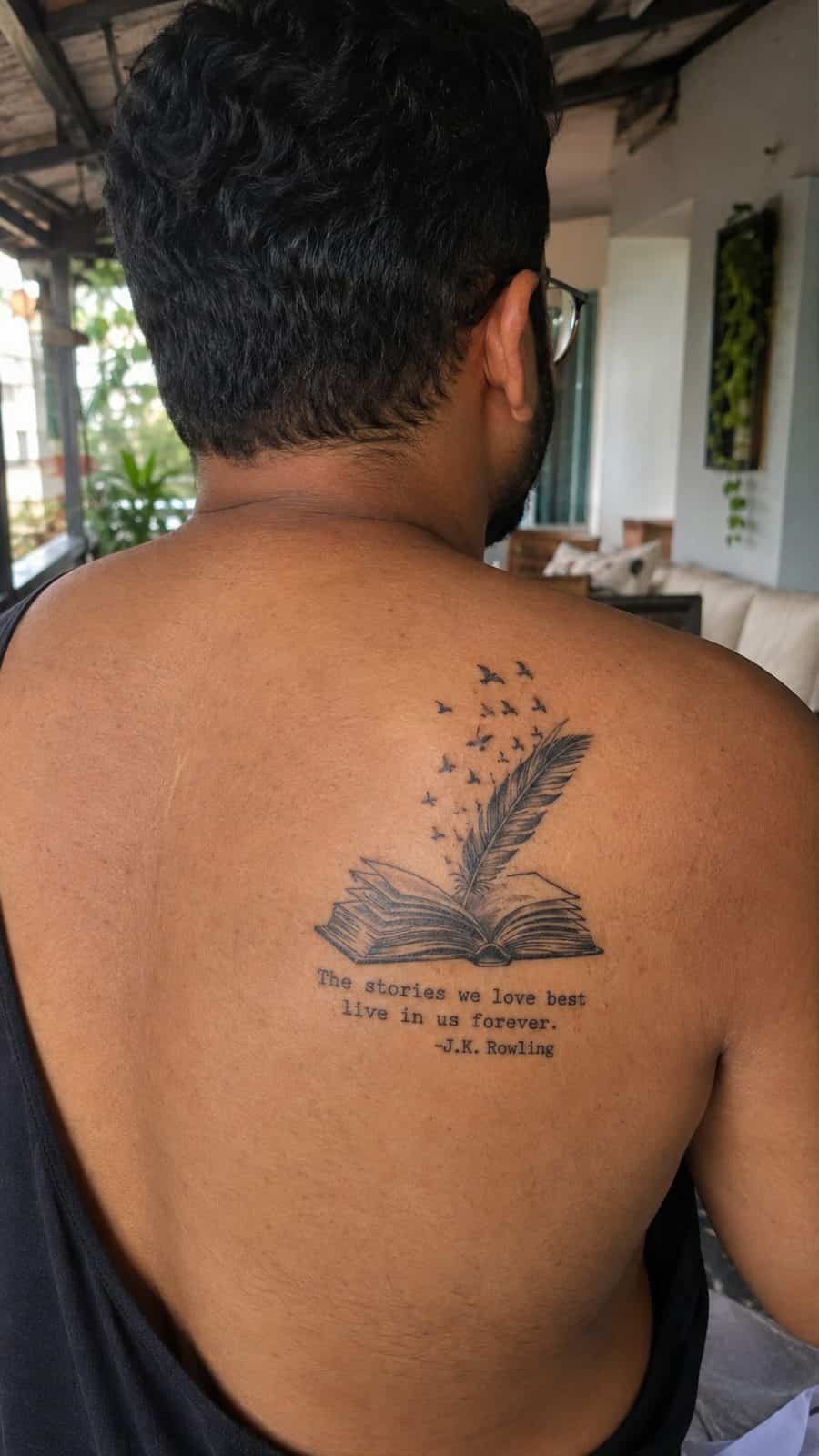 48 Tattoo Ideas for Men Worth Considering for Your Next Ink 18 Healed narrative ink tattoo on a adult man's upper back, photographed in a natural waist-height candid close-up — study 2