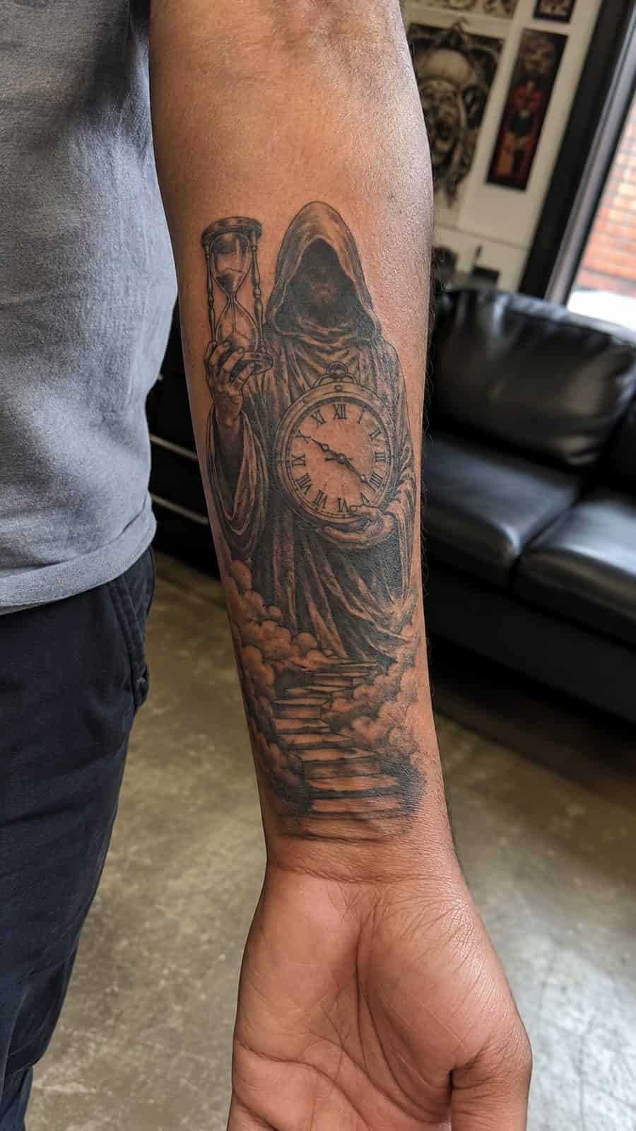 48 Tattoo Ideas for Men Worth Considering for Your Next Ink 21 Healed time's keeper tattoo on a adult man's inner forearm, photographed in a natural slightly elevated close view — study 1