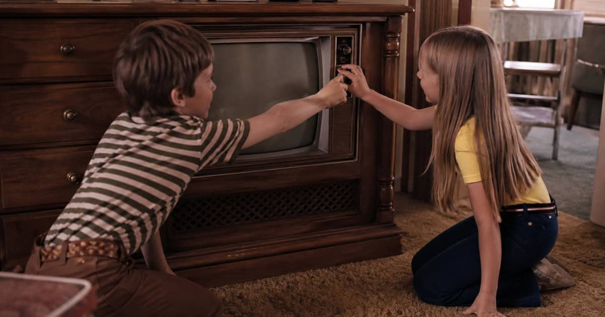 Siblings negotiating over the television channel dial in the 1970s