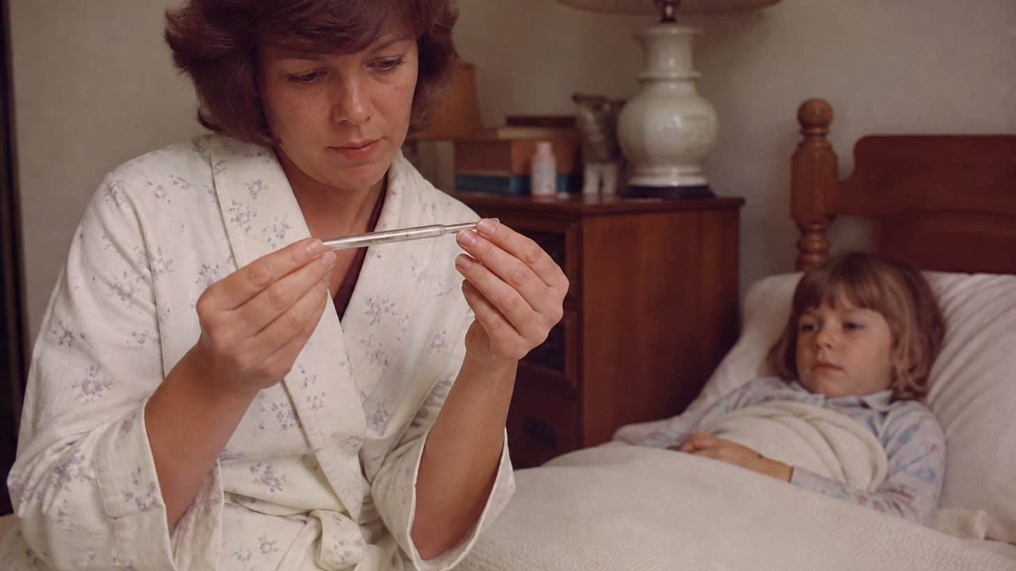 What 1970s Doctors Did That Would Lead to Lawsuits Today 9 Parent reading a glass mercury thermometer in a 1970s home