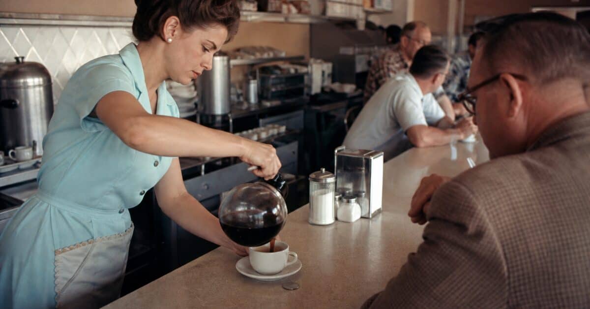 14 Things You Could Buy for a Nickel in 1960 (That Cost $20+ Now) 9 Diner waitress pouring a cup of coffee beside a nickel in 1960