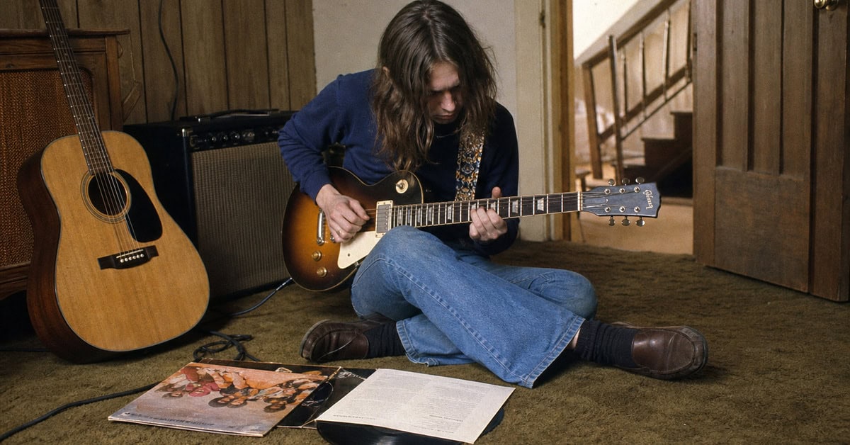 13 Classic Rock Ballads That Instantly Take You Back 2 Young guitarist working on a song arrangement in an early-1970s rehearsal room